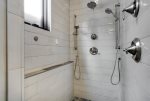 Luxuriously large walk in shower with multiple shower heads